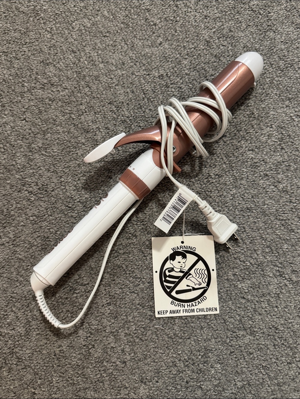 Conair Double Ceramic 1.5-Inch Curling Iron features a rose gold barrel